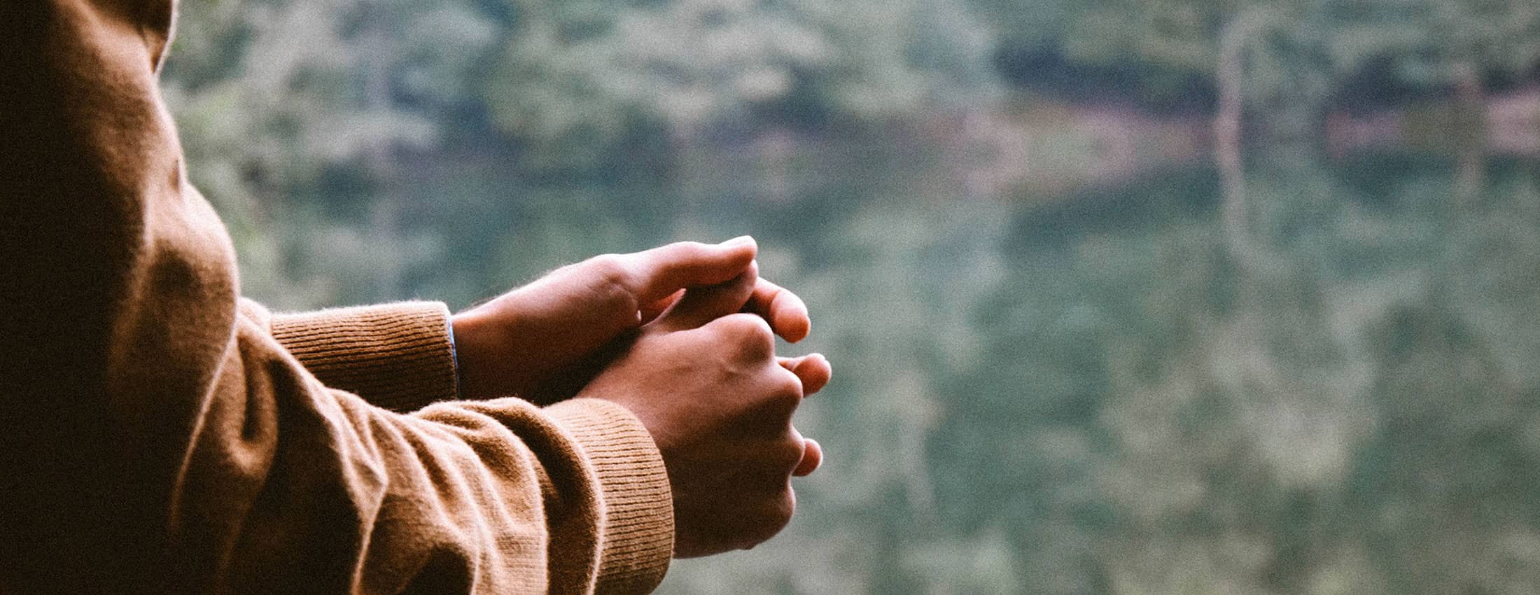 hands at window